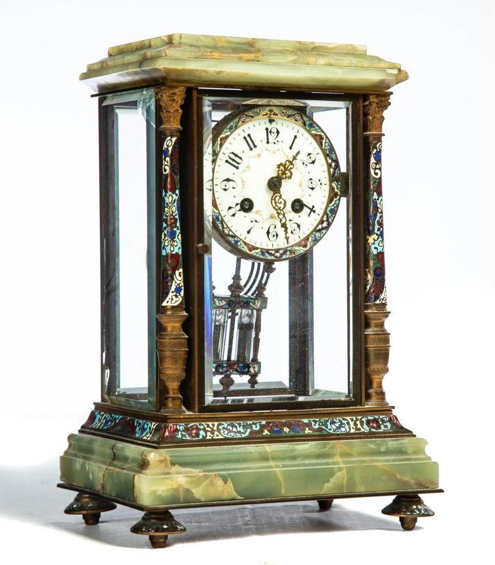 ONYX AND CHAMPLEVE CRYSTAL REGULATOR MANTLE CLOCK.: ONYX AND CHAMPLEVE CRYSTAL REGULATOR MANTLE CLOCK. France, 4th quarter-19th century. Beveled glass panels, brass case with champleve trim, porcelain face with floral swags, mercury pendulum, and brass