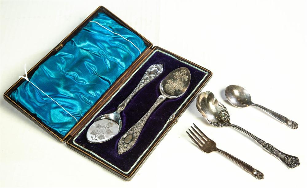 FIVE PIECES OF SILVER PLATE.: FIVE PIECES OF SILVER PLATE. American. A boxed pair of Walker and Hall sauce spoons with engraved bowls, Rogers Bros "Eternally Yours" baby spoon and fork and a Rogers Bros sugar shell.