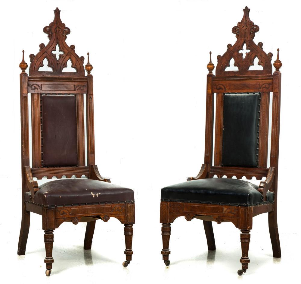 PAIR OF GOTHIC REVIVAL PULPIT CHAIRS.: PAIR OF GOTHIC REVIVAL PULPIT CHAIRS. American, 4th quarter-19th century, walnut. Incised carving, pointed arch crests with turned finials, hip rests and turned front legs, upholstered backs and seats
