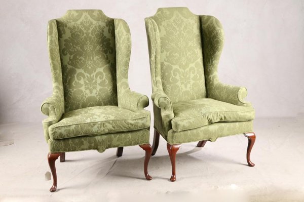 PAIR OF TRADITIONAL STYLE WINGBACK ARMCHAIRS. Oli