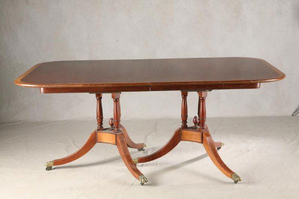 DUNCAN PHYFE STYLE TABLE. Mahogany with cross ban: DUNCAN PHYFE STYLE TABLE. Mahogany with cross banded top. Double pedestal base. One leaf, extends top to 42"x891/2".28 ½"h.