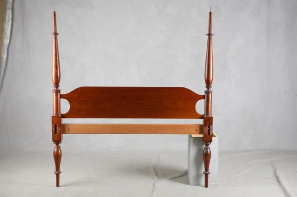 SHERATON STYLE TALL POST BED. Cherry with figured: SHERATON STYLE TALL POST BED. Cherry with figured mahogany veneer on posts. Arched canopy frame. 57 ½"w. 75 ½" rails.
