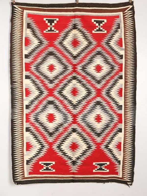 NAVAJO WEAVING. In a diamond pattern. Minor s