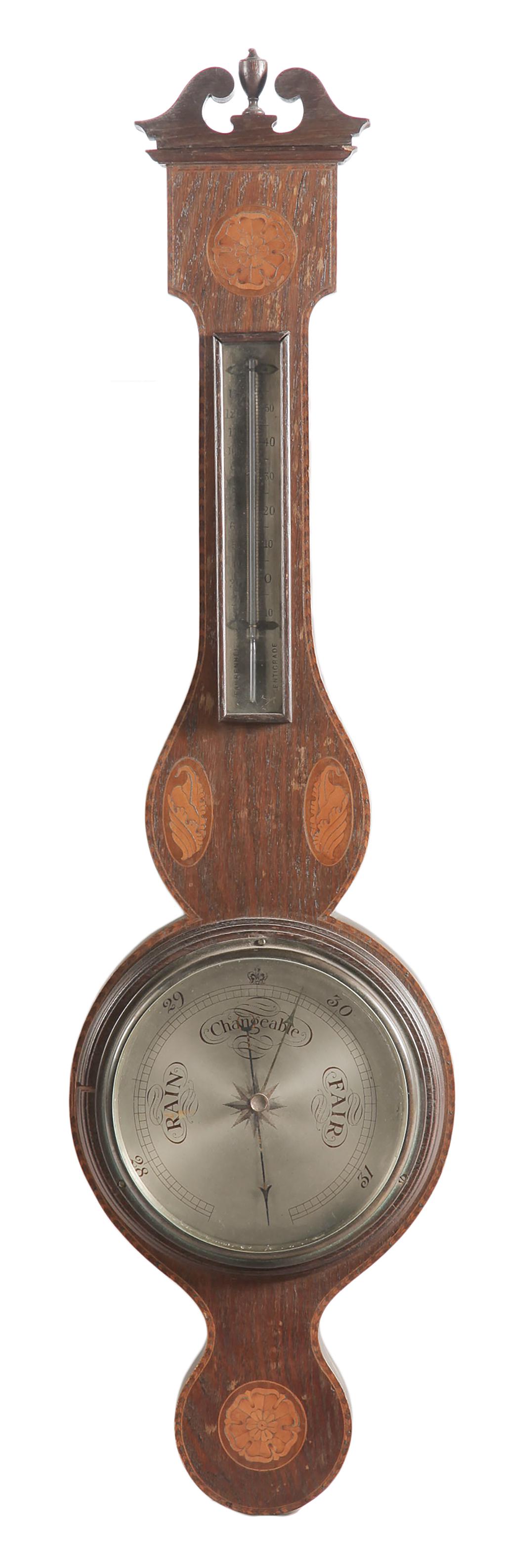 INLAID BAROMETER.: England, late 19th Century. Ash with banded inlay, shells and flowers and brushed steel face and dial.
