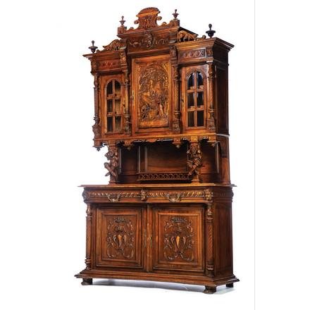 CARVED COURT CUPBOARD.: European. 2nd half-19th century. Walnut with oak secondary, top with carved crest, stepped molded cornice, carved frieze with center Minerva head, rope turned pilasters, center door with three dimensi