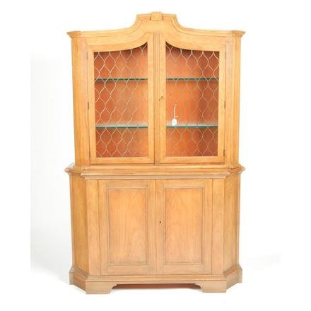BAKER TWO-PIECE CABINET.: American. 2nd half-20th century. Fruitwood in the French style, molded cornice, two upper doors with brass mesh panels, and glass shelves, bottom with single panel doors and base molding. 72"h. 47"w. 