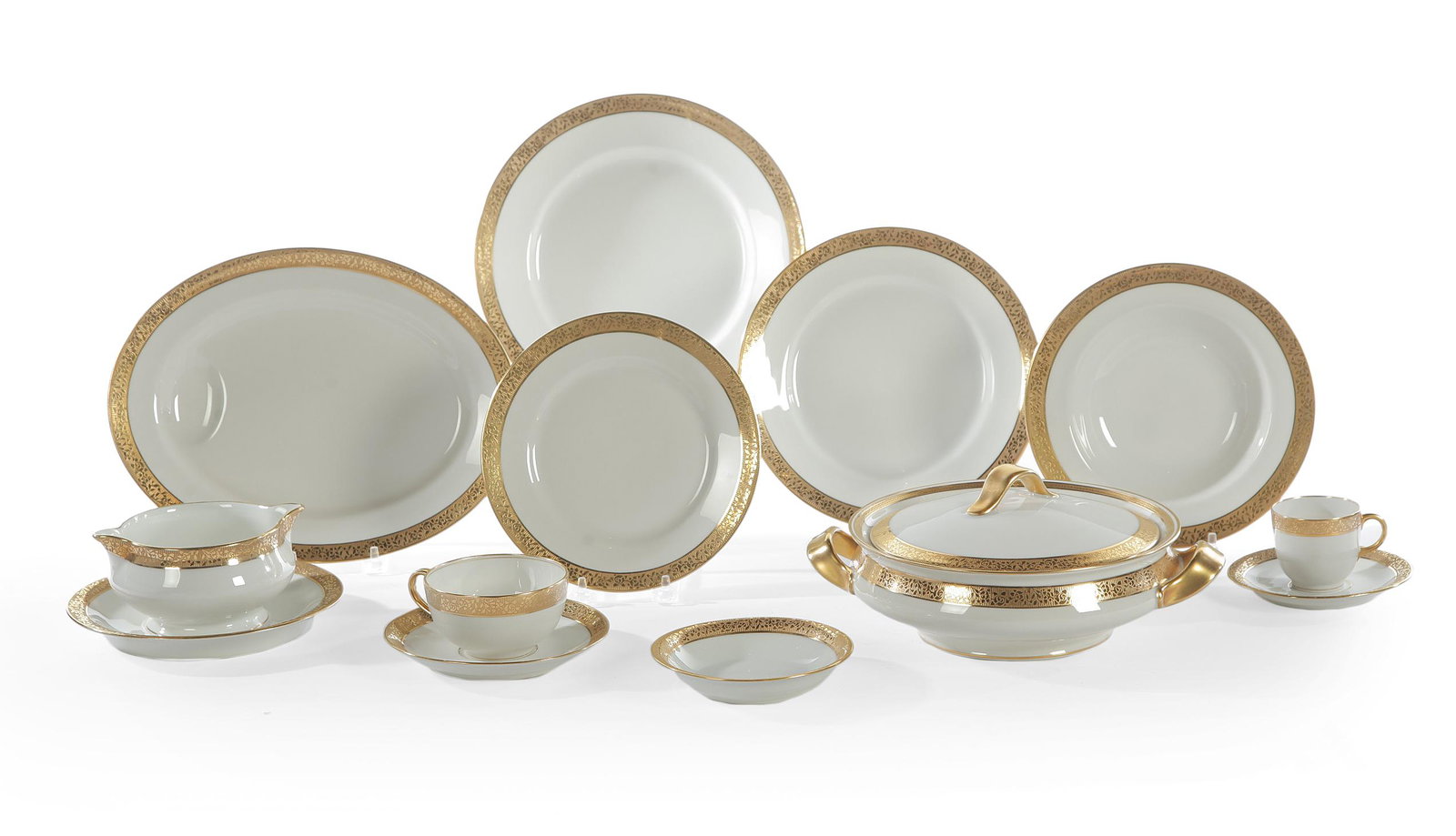 LARGE SET OF THEODORE HAVILAND GOLD BAND CHINA.: France, 1st half 20th Century. White porcelain with floral embossed gold border. Twelve dinner plates, twelve lunch plates, twelve dessert plates, twelve bread and butter plates, eighteen soup plates,