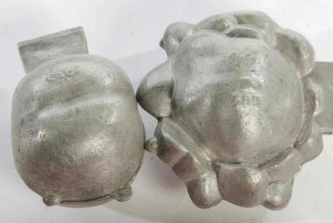 TWELVE PEWTER ICE CREAM MOLDS.: American, late 19th, early 20th century. Including grapes, ship, banana, apple, peach, strawberries, bird, and others.