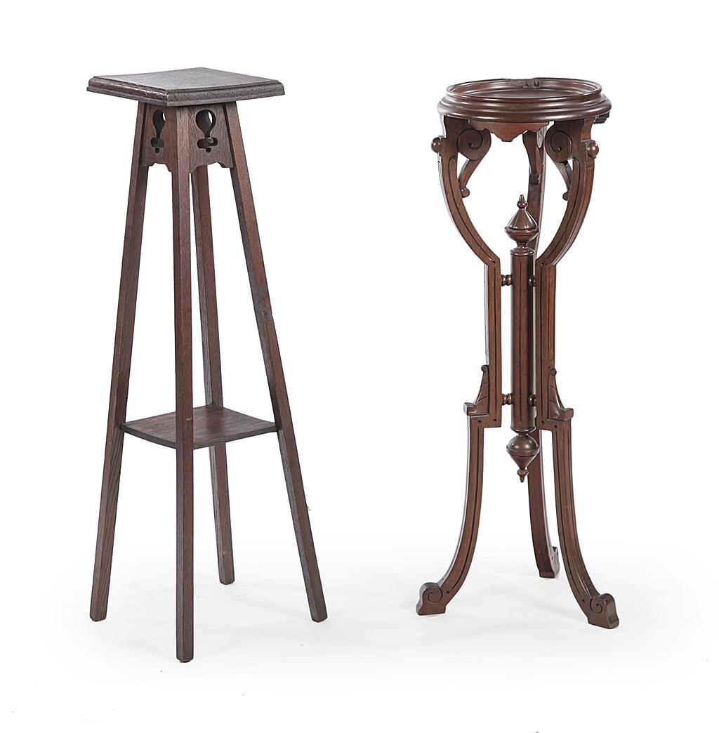 TWO FERN STANDS.: American. Eastlake Victorian stand in walnut, round top, curved legs with line carving and center turned column. 34"h. 11"d. and Arts & Crafts in oak with square top and shelf, cutout skirt and canted