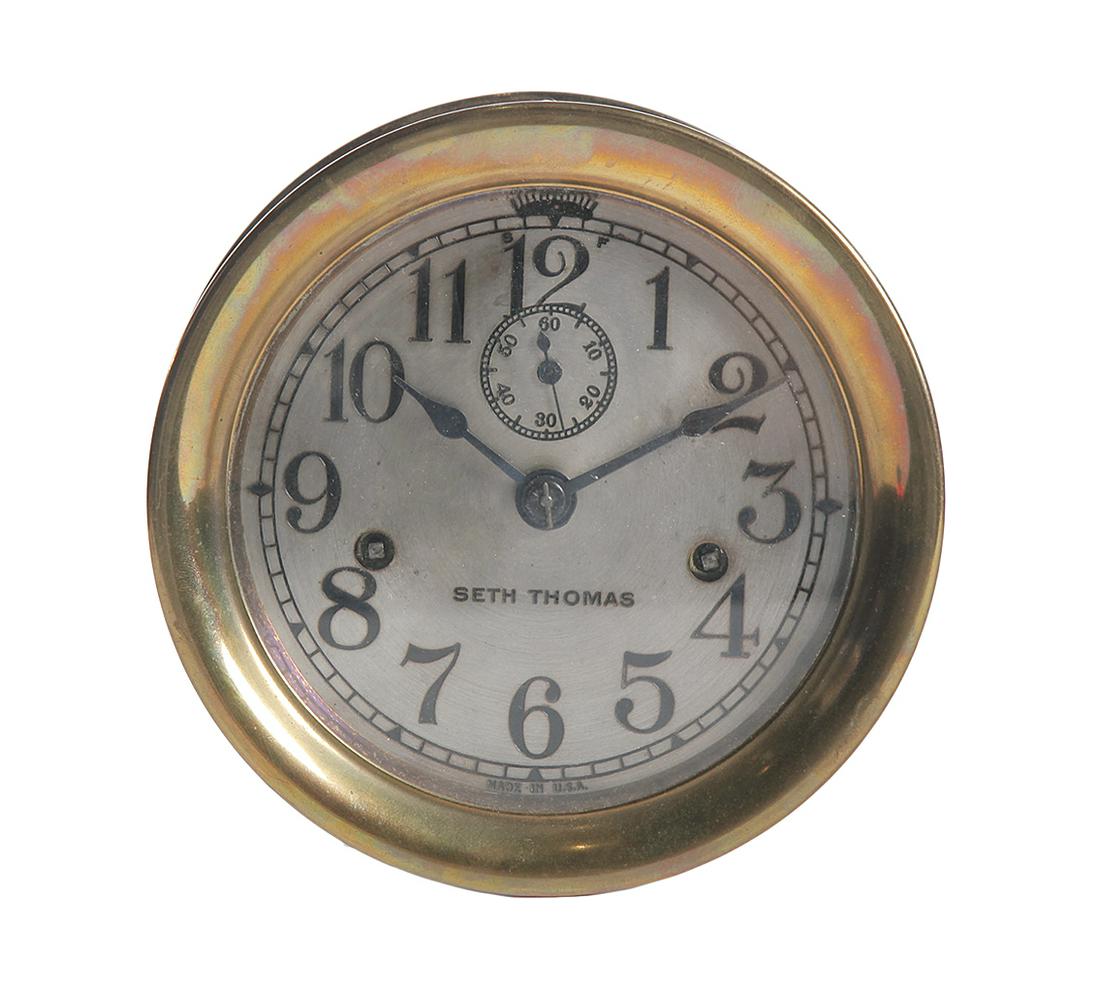 SETH THOMAS SHIPS CLOCK.: American. 1st quarter-20th century. Brass case, brushed steel face and movement with time, seconds and bells, 7" diameter, 3.5"d.