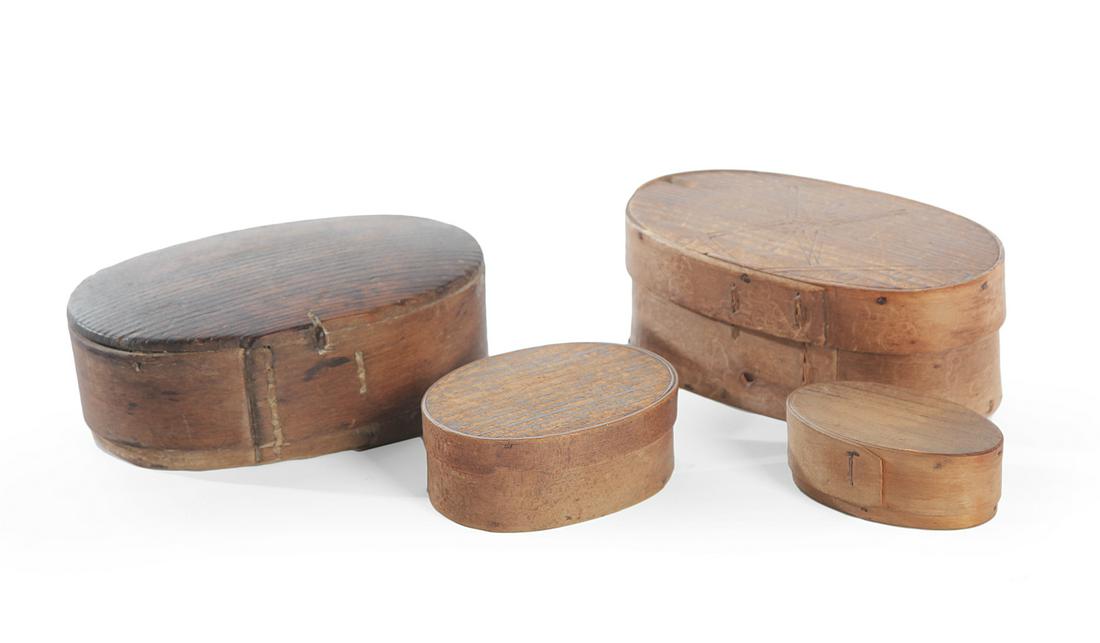 FOUR SMALL BENTWOOD BOXES.: American. 2nd half-19th century. Elliptical shapes in pine, larger have sewn seams, 2"h. 6.5"w. 3.5"d and 2.5"h. 6.5"w. 4.5"d., tacked "Harvard" joints, 1.5"h. 4"w. 3"d., and stapled joints, 1.5"h. 3.