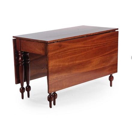 AMERICAN SHERATON DROP LEAF TABLE.: Second quarter 19th century, cherry. Turned legs and feet, multiple board top and leaves. Refinished and top reattached. 30.5”h. 49”w. 23.5”d. with 21.5” leaves.