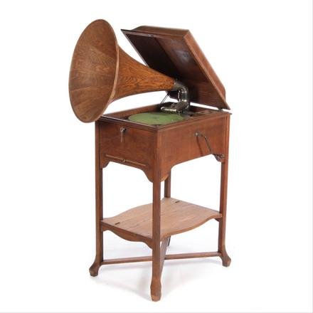 VICTOR VICTROLA XXV "SCHOOLHOUSE" MODEL.: American, 1st quarter 20th century. Oak with laminate, late 20th century horn. 42" h. 20" w. 27" d.