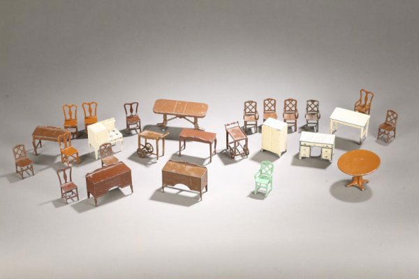 TWENTY SIX PIECES OF TOOTSIETOY DOLLHOUSE FURNITUR: TWENTY SIX PIECES OF TOOTSIETOY DOLLHOUSE FURNITURE. Fourteen chairs, three tables, two tea carts, two sideboards, two side tables, desk with three drawers, stove, and a refrigerator. Five damaged/rep