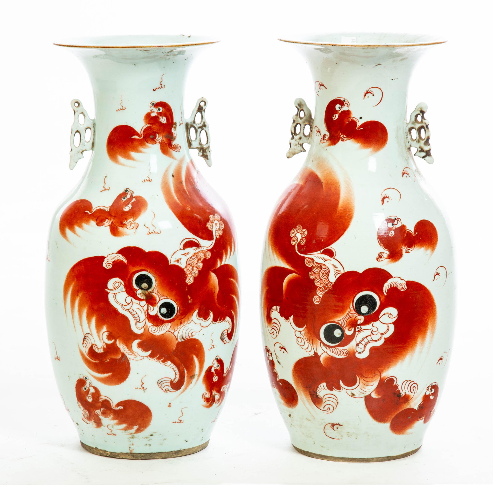 TWO CHINESE PORCELAIN VASES.: Early 20th century. Hand decorated with red foo dogs, text on the back. Surface wear. 17"h.