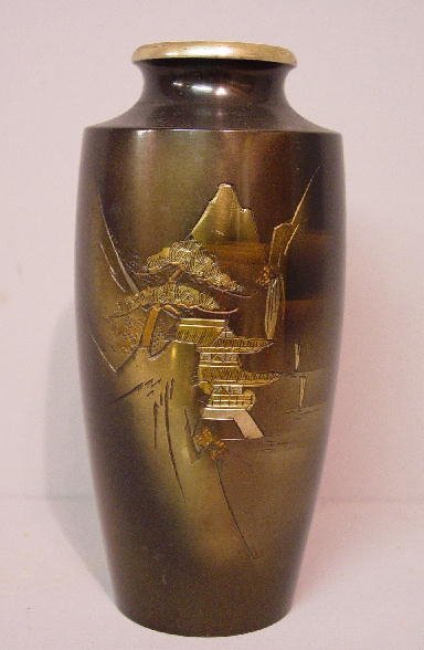 THREE ORIENTAL PIECES: Pair of brass vas