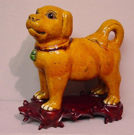 CHINESE POTTERY DOG. Happy looking dog w