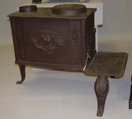 EARLY CAST IRON STOVE. Small size with v