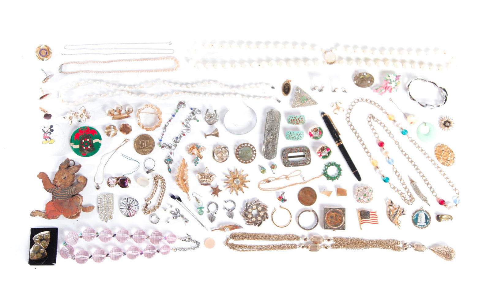 GROUP OF VINTAGE COSTUME JEWELRY.: Mid-late 20th century. Assortment of vintage costume jewelry comprised of earrings, bracelets, pins, and more. Marked pieces by Coro, Sarah Cov and Avon. Some pieces may need minor repairs.