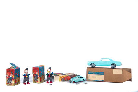 FOUR TOYS.: Mid 20th century. American plastic 1967 Cougar model car, 10.5"l. With box. And three German Schuco toys with boxes. Two clowns (one box damaged), 5"h. and a Magico-Auto car, 5.5"l. Together with an e