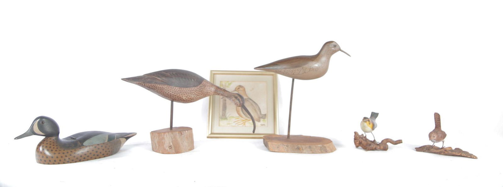 FIVE BIRD CARVINGS.: American, 2nd half 20th century. Two carved shorebirds, both signed. (Charles) Moore, 12"h. And "Oroutt", 9"h. including bases, carved box in the form of a duck with original paint and lift lid. 12.5"