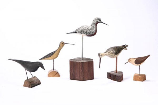 FIVE CARVED BIRDS.: FIVE CARVED BIRDS. American, late 20th century. Wood with original paint. A plover, sandpiper and a crow impressed "WEK" for William Kirkpatrick, Massachusetts. 5 1/2", 5 1/2", 7 1/2"h. Also two plove