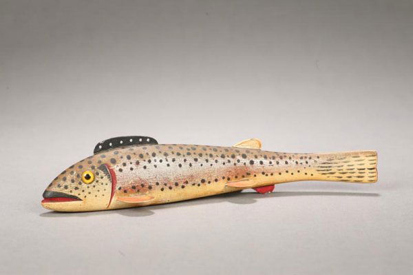 FISH DECOY.: FISH DECOY. Attributed to Oscar Peterson, Cadillac, Michigan, 1887-1951, softwood. Rainbow trout with original paint, glass eyes and tin fins. Two weights. Minor flaking on fins. 8 1/2"l.