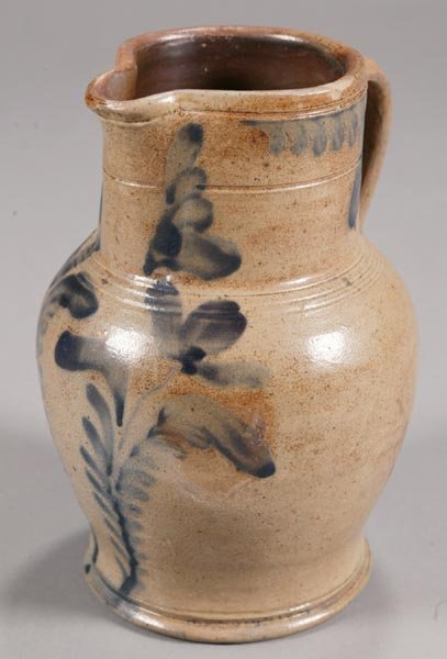 STONEWARE HANDLED PITCHER.