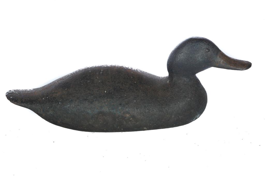 AMERICAN CAST IRON DUCK DOORSTOP.: First half - 20th century. Solid body in an old dark surface, with worn yellow painted bill and raised eyes. Especially good form. 16.5"l. Ex Robert Treichler (Ohio), sold at Garthâ€™s, July 30-3