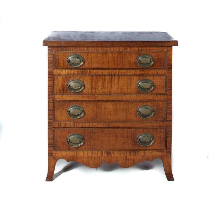 CHILDS' SIZE HEPPLEWHITE CHEST.: American, 4th quarter-20th century, tiger maple with pine secondary. Four dovetailed drawers with beaded fronts, solid end, and French feet. Terry McFadden, Roseville, Ohio cabinet maker. 21"h. 20"w. 