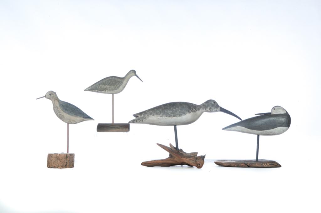 FOUR CARVED AND PAINTED SHOREBIRDS.: American, 2nd half-20th century. Two are full bodied in grey, white, and black paint and have branded mark, "ADAMS," 11"h. and 10"h. And two are silhouette in mottled grays, black, etc., 11.5"h. and 1
