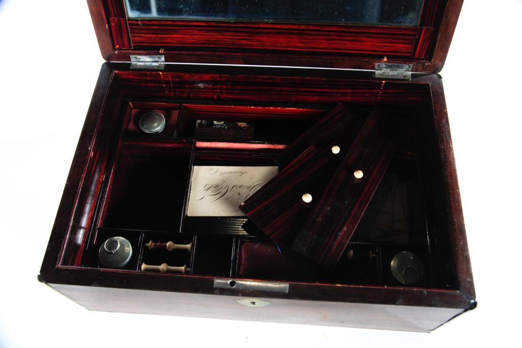 ENGLISH DRESSING BOX.: Second half-19th century, rosewood veneer. Brass trimmed box with fitted interior and mirror in the lid. Handwritten calling card for "Thomas Colpitts, Painesville, Ohio", Fall down mirror frame is st