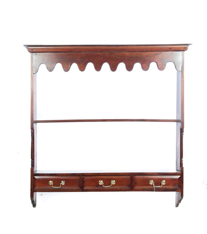HANGING SHELF.: Asian, mid 20th century, teak. Continental-style hanging shelves with scalloped crest and freestanding columns. Three dovetailed drawers. Refinished with repaired corner on cornice. 43.5"h. 43.5"w.8.5