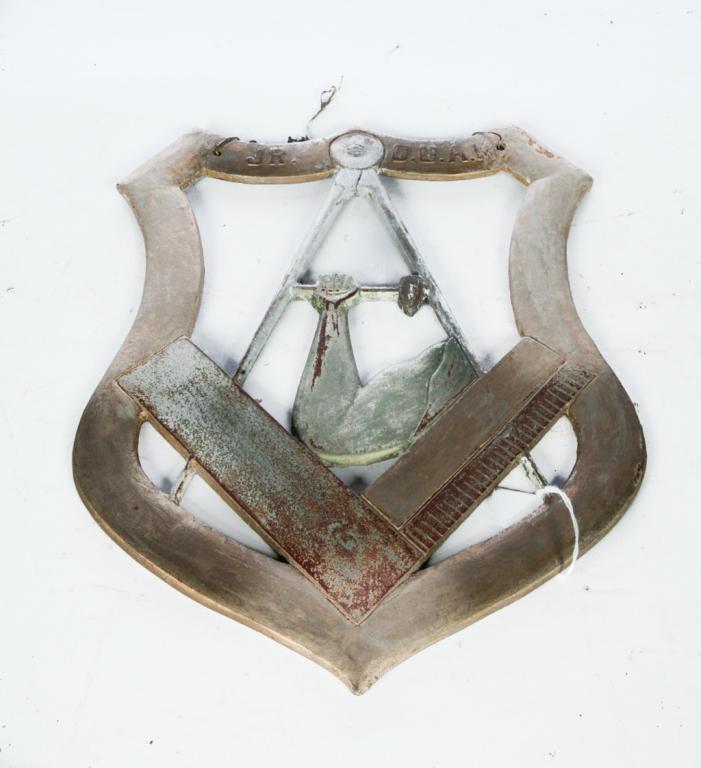 AMERICAN CAST IRON MASONIC SIGN.: Early 20th century. Openwork shield with Mason's compass and square "Jr. O.U.A.M". Old paint. 14"h. 10.5"w.