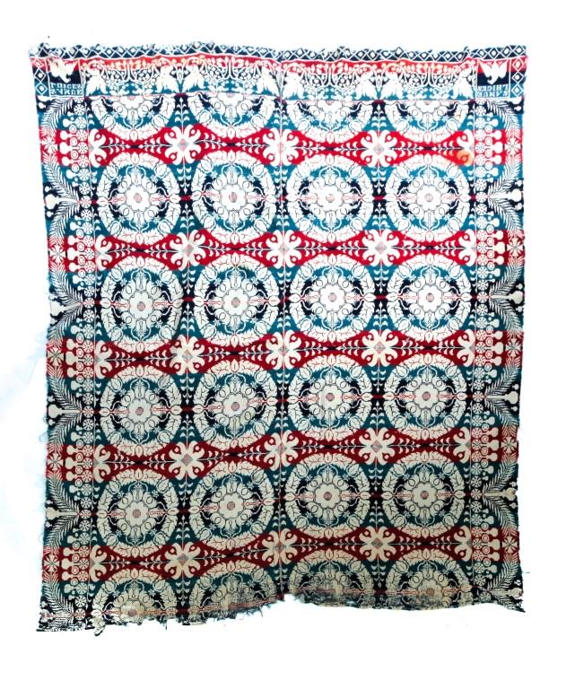 TWO TWO-PIECE COVERLETS WITH CORNER BLOCKS.: American, mid 19th century. Blue ad white floral with "Daniel Fisher, South Bend, E. Miller, 1853." Heavy wear and some stains. 68"w. 88"l. And red, blue, teal, and cream with "Samuel L. Hicks" with e