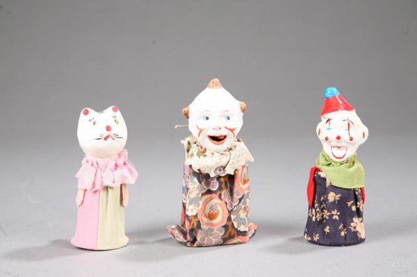 THREE CHILD'S TOY FIGURES. Includes a marked Germ: THREE CHILD'S TOY FIGURES. Includes a marked German jester with a chalk head and a tongue that sticks out, 5"h.; and two marked Japanese figures with papier mache heads, including a cat, 4"h., and a j