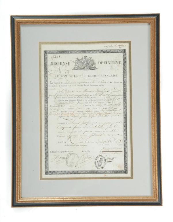 FRENCH MILITARY DOCUMENT.: Printed on paper with pen and ink notations. "Dispense Definitive au nom de la Republique Francaise", an army discharge with penciled date at bottom August 21, 1804. Creases and stains. Late frame, 19
