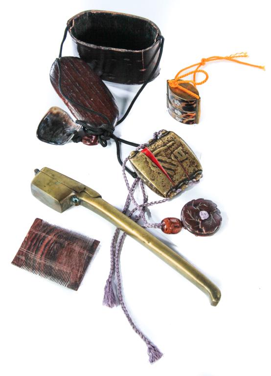 FOUR JAPANESE INRO AND PIPE HOLDER.: Late 19th-20th century. Two inro. Tortoise shell with chrysanthemum accents, 1.75"h. and brass with lacquered interior (for ink and pen?), with boxwood gourd carved netsuke. 2"h. And a bark and wood t