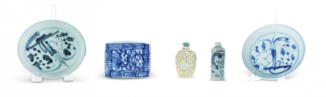 FIVE PIECES OF CHINESE PORCELAIN.: Late 19th-20th century. Hand decorated. Box with incised text inside, 1.5"h. 3.5"w., two small sauces, 5"d. and two snuffs. One yellow and one with blue dragons. Both with faux Qianlong marks. 3"h.