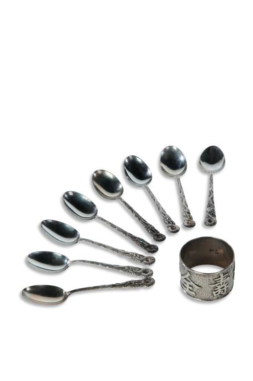 NINE PIECES OF CHINESE EXPORT SILVER.: Late 19th-early 20th century. Hallmarked. Napkin ring with Chinese symbols by Tien Shing, and eight demitasse spoons with dragon handles by Tuck Chang, 4.25"l.