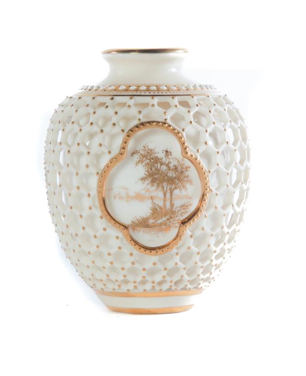 ROYAL WORCESTER RETICULATED DOUBLE-WELLED VASE.: England, dated 1899. Ivory bone china, white enamel, and gold trim and decoration. Scenic reserves in gold on interior wall and green mark on bottom. 3.25"h.