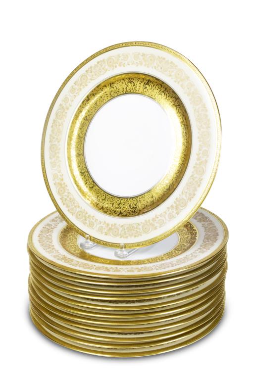 12 T & V LIMOGES SERVICE PLATES.: France, 1st quarter 20th century. White porcelain with ivory borders, heavy gold borders, and floral decoration. Green "T&V, Limoges, France" and gold "T&V" characters mark. 10.5"dia.