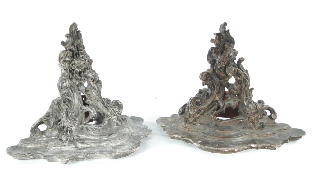 PAIR OF MARKO PLASTER BRACKET SHELVES.: New Jersey, dated 1969. Rococo style shelves with distressed black paint. Labeled "Marko Mkrs 1969". Some wear, copper brackets may be added. 15"h. 20"w. 10"d