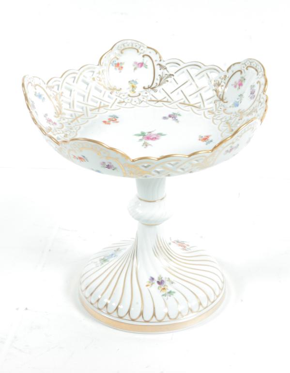 MEISSEN RETICULATED COMPOTE.: Germany, 1st half 20th century. White porcelain, reticulated bowl, Dresden flower design and gold trim and leaf decoration. 8.75"h. 9" dia.