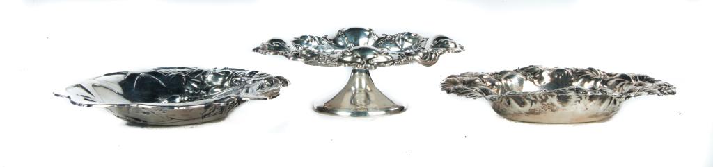 THREE PIECES OF HEAVILY EMBOSSED STERLING.: American, 1st half 20th century. Shiebler footed mint dish with leaf bracket border. 2.5"h. 7"w. 5.25"d. Watson oval dish with floral border. 1"h. 7"w. 5.5"d. And Simpson, Hall and Miller dish with ro