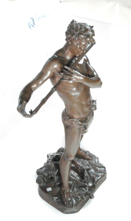 BRONZE IMPROVISATEUR, FELIX CHARPENTIER.: France, 1858-1924. Twentieth century, signed on the base with title and Paris foundry mark E. Colin & Cie. Youth with a grapevine headdress, playing a flute. 30.5”h.