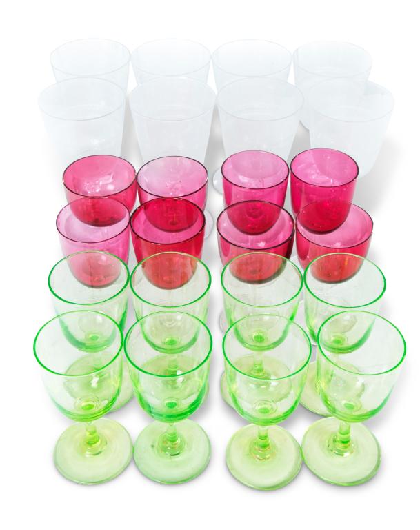 THREE SETS OF EIGHT FLINT-GLASS STEMS.: American, 2nd half 19th century. Eight clear with double teardrop panel-cut stems and diamond point engraved bowls, 6"h. Eight canary wines with ground and polished pontils, 5"h. And eight cranberry b