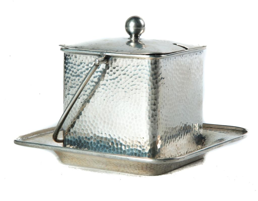 E. GOLDSCHMID 800 SILVER MARMALADE JAR.: European, 1st quarter 20th century. Square lidded jar and under plate, hand-hammered decoration with cut-glass insert. 3.75"h. 4.5"square.