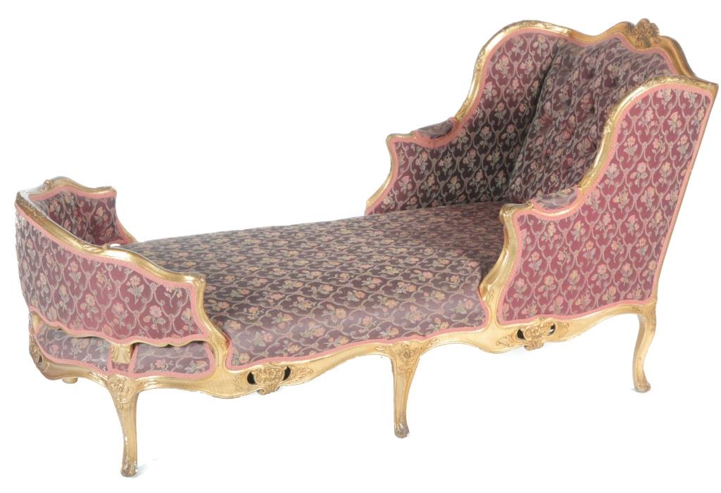 LOUIS XV XTYLE GILDED CHAISE LOUNGE.: European, mid 19th century. Hardwood frame with shell and foliate carving, skirt with pierced carvings, gently curved legs, floral upholstered seat, arms and tufted back. 42"h. 33"w. 78"l.