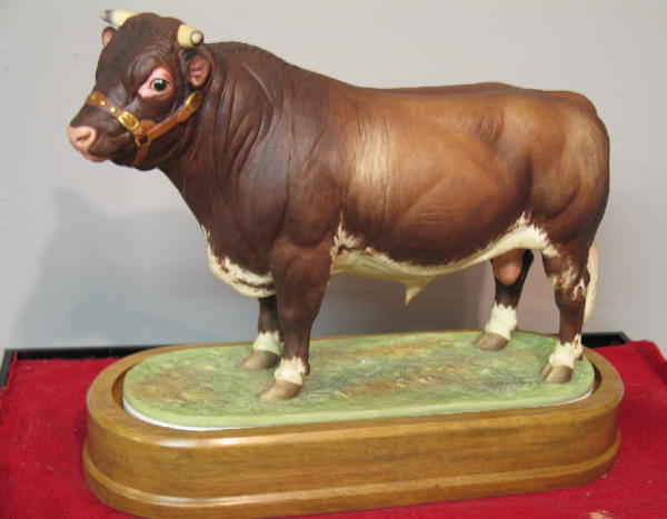 "ROYAL WORCESTER" BISQUE FIGURE. Limited edition o: "ROYAL WORCESTER" BISQUE FIGURE. Limited edition of a Dairy Shorthorn bull modeled by Doris Lindner and hand painted. Labeled on the bottom and produced in 1965. Comes with a display case and numbered